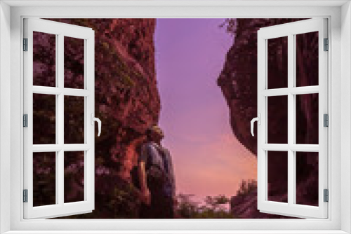 Fototapeta Naklejka Na Ścianę Okno 3D - Hiker enjoying the view, against silhouette of rock mountains at sunset, Three whale rock mountain at Phu Sing , Bueng Kan Province,Thailand