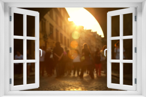 blurred background. a lot of people walking on a city street.