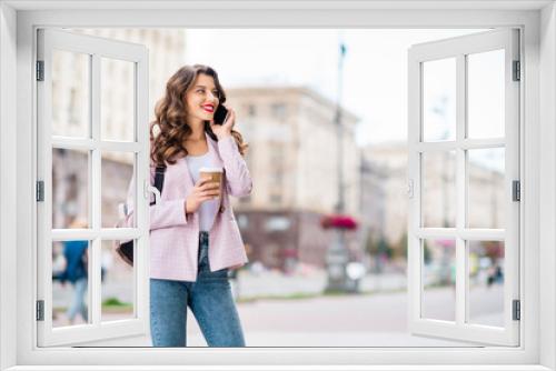 Portrait of her she nice-looking attractive lovely cute cheerful cheery wavy-haired lady foreign tourist making call home discussing adventure landmark sightseeing in downtown center outdoors