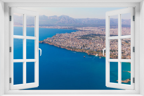 Fototapeta Naklejka Na Ścianę Okno 3D - Window view of an airplane on the coast of Antalya with beautiful Taurus Mountains on the horizon, Turkey