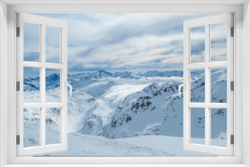 Fototapeta Naklejka Na Ścianę Okno 3D - Beautiful and serene landscape of mountains covered with snow in Mölltaler Gletscher, Austria. Thick snow covers the slopes. Clear weather. Perfectly groomed slopes. Massive ski resort. Glacier skiing