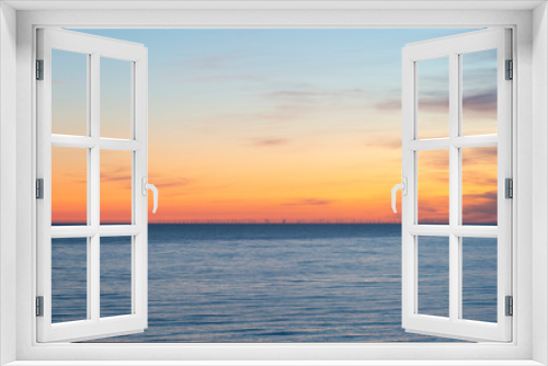 Fototapeta Naklejka Na Ścianę Okno 3D - Beautiful Summer landscape sunset image of colorful vibrant sky over calm long exposure sea