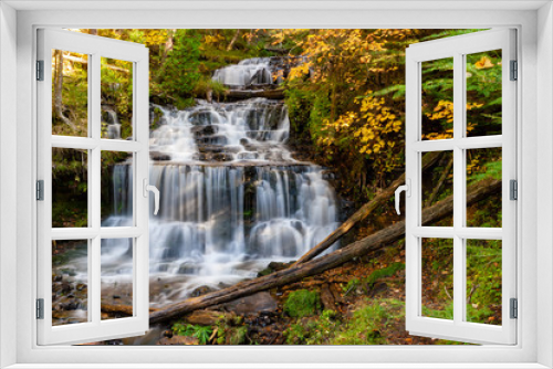 Fototapeta Naklejka Na Ścianę Okno 3D - waterfall in the forest surrounded by fall foliage