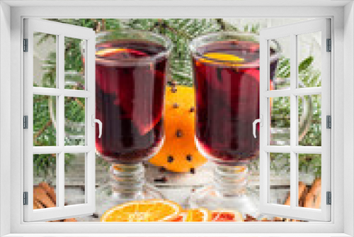 Fototapeta Naklejka Na Ścianę Okno 3D - christmas hot mulled wine with cinnamon orange and anise on white wooden background