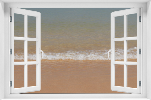 Fototapeta Naklejka Na Ścianę Okno 3D - Sandy beach, scenic view to empty sea coast with yellow sand and clear wave with white foam. Picturesque tropical seascape