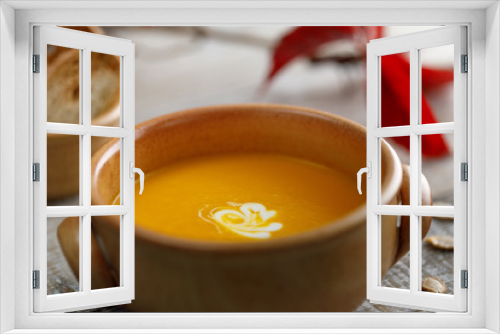 Fototapeta Naklejka Na Ścianę Okno 3D - Pumpkin cream soup in a ceramic dish