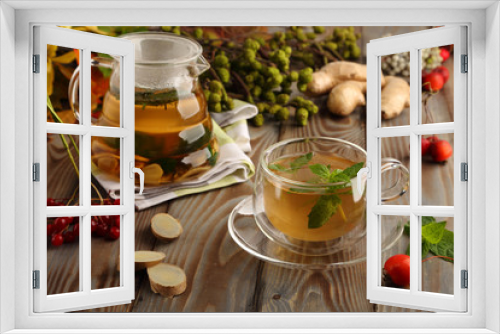 Fototapeta Naklejka Na Ścianę Okno 3D - Seasonal, ginger-mint tea, a healthy drink for colds, in late autumn and cold winter.