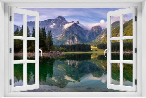 Fototapeta Naklejka Na Ścianę Okno 3D - magnificent landscape which consists of a panorama of mountain lake and mountains reflecting in a mirror of water of the lake