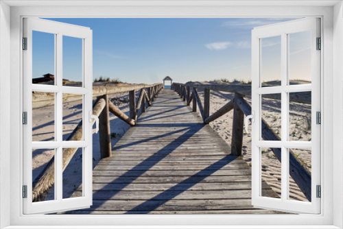 Fototapeta Naklejka Na Ścianę Okno 3D - pasarela de madera en una playa