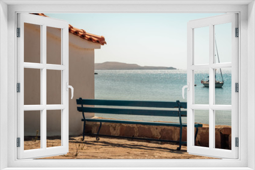 Fototapeta Naklejka Na Ścianę Okno 3D - Widok na morze z ławka i żaglówką Grecja Lesvos