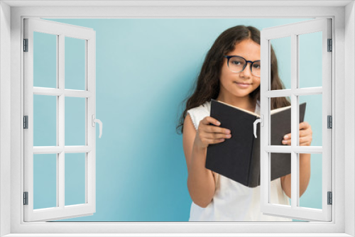 Adorable Female Student Reading Book