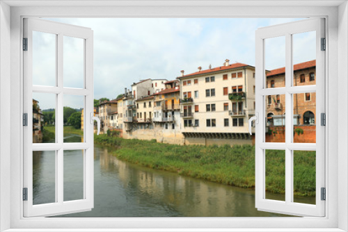 Fototapeta Naklejka Na Ścianę Okno 3D - Wide Bacchiglione River and the houses in Vicenza City in italy