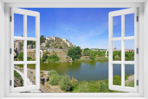 Fototapeta Naklejka Na Ścianę Okno 3D - Panoramic view of the former Imperial City of Toledo, a UNESCO World Heritage site located on the Tagus River in Castile La Mancha, Spain