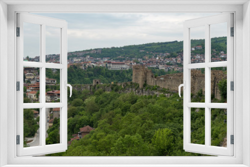 Gate tower and ruins of Tsarevets fortress with a view of the old town of Veliko Tarnovo in the background, Bulgaria