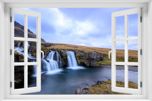 Fototapeta Naklejka Na Ścianę Okno 3D - Iceland timelapse photography of waterfall and famous mountain. Kirkjufellsfoss and Kirkjufell in northern Iceland nature landscape