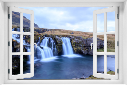 Fototapeta Naklejka Na Ścianę Okno 3D - Iceland timelapse photography of waterfall and famous mountain. Kirkjufellsfoss and Kirkjufell in northern Iceland nature landscape
