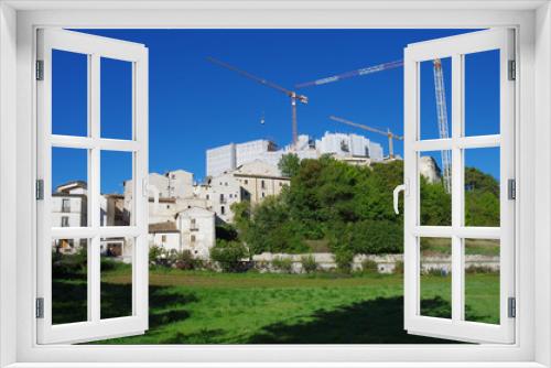 Fototapeta Naklejka Na Ścianę Okno 3D - Reconstruction of the post-earthquake in Santo Stefano di Sessanio, L'Aquila, Abruzzo, Italy. You see the cranes that work