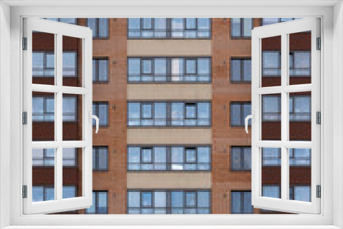 Fototapeta Naklejka Na Ścianę Okno 3D - Facade of a modern multistory residential building