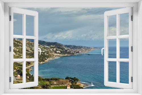 Fototapeta Naklejka Na Ścianę Okno 3D - Mediterranean coastal landscape in Northern Italy Riviera, view of Ventimigla, town by the French border