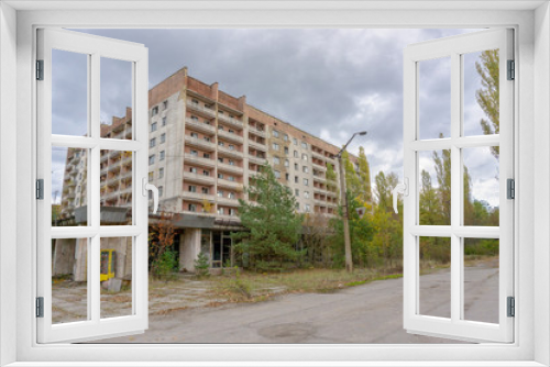 Fototapeta Naklejka Na Ścianę Okno 3D - City ghost Pripyat. Chernobyl Exclusion Zone. The accident at the Chernobyl nuclear power plant. The consequences of the accident. Yellow radiation sign. Dangerous territory. Infection with radiation.