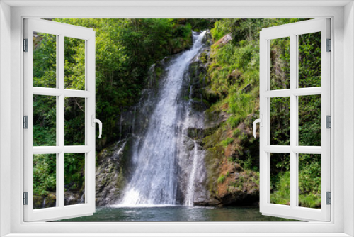 Fototapeta Naklejka Na Ścianę Okno 3D - Waterfall in the middle of a forest