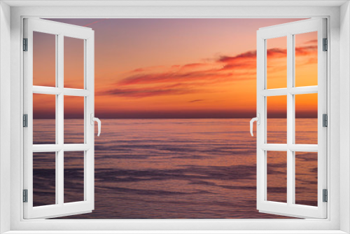 Fototapeta Naklejka Na Ścianę Okno 3D - Looking out to sea at sunset, from Jersey in the Channel Islands