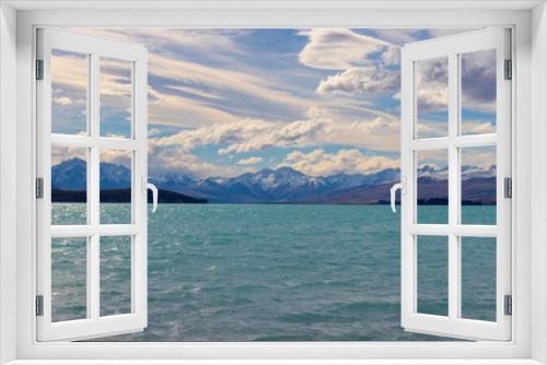 Fototapeta Naklejka Na Ścianę Okno 3D - Clouds and mountain backdrop to clear blue lake in New Zealand