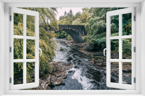 Fototapeta Naklejka Na Ścianę Okno 3D - A view of a bridge in the Highlands of Scotland 