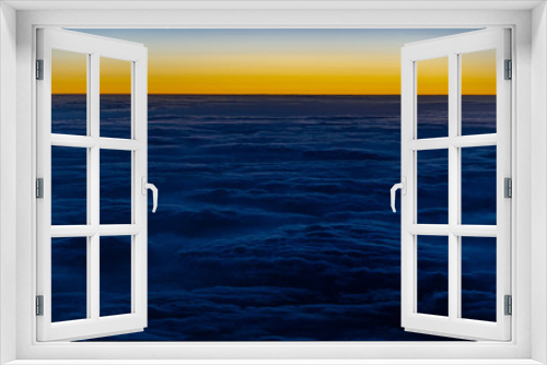 Fototapeta Naklejka Na Ścianę Okno 3D - Sonnenaufgang aus Flugzeug