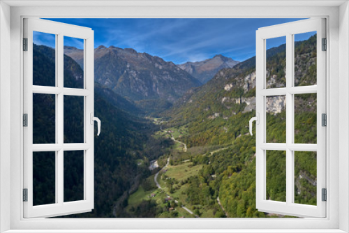 Autumn season, red-yellow trees. Aerial photography. Panoramic view of the Alps north of Italy. Trento Region. Great trip to the Alps.