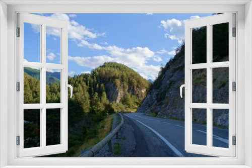 Fototapeta Naklejka Na Ścianę Okno 3D - curly road on the mountain Forest through narrow val in french alps, France