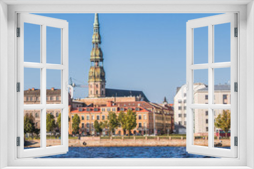 Fototapeta Naklejka Na Ścianę Okno 3D - View of the original spire of St. Peter's Church from the Daugava River. City landscape, Riga, Latvia.