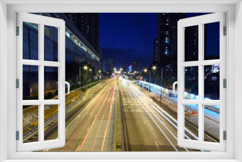Fototapeta Naklejka Na Ścianę Okno 3D - Traffic through downtown in Hong Kong