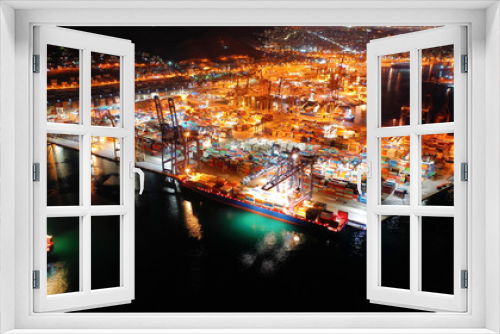 Fototapeta Naklejka Na Ścianę Okno 3D - Aerial night shot of illuminated industrial cargo truck size container terminal in Asia port