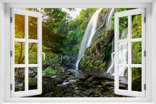 Fototapeta Naklejka Na Ścianę Okno 3D - A beautiful waterfall deep in the tropical forest steep mountain adventure in the rainforest.