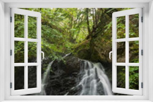 Fototapeta Naklejka Na Ścianę Okno 3D - The waterfalls at  Fairy Glen, a hidden jewel found after a 30-minute hike through the woodlands near the town of Rosemarkie, Scotland on the Black Isle Peninsula.