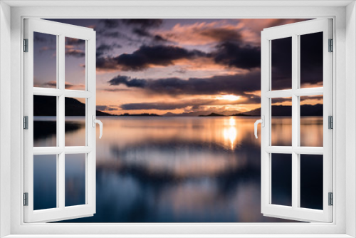 Fototapeta Naklejka Na Ścianę Okno 3D - loch linnhe in the argyll region of the highlands of scotland during an autumn sunset showing golden light on the clouds and water and the islands of lismore and shuna