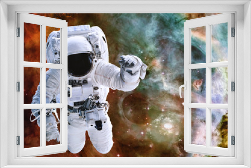 Fototapeta Naklejka Na Ścianę Okno 3D - Astronaut somewhere in deep space. Elements of this image were furnished by NASA