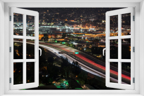 Fototapeta Naklejka Na Ścianę Okno 3D - Night view of  traffic on Interstate 5 in downtown Burbank near Los Angeles, California.