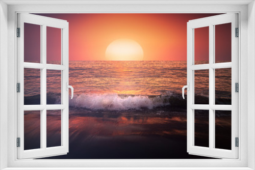 Fototapeta Naklejka Na Ścianę Okno 3D - red sunset on beach with a wave on the shore and big sun