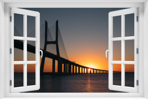 Fototapeta Naklejka Na Ścianę Okno 3D - Vasco da Gama Bridge at sunrise in Lisbon, Portugal. Second longest bridge in Europe.