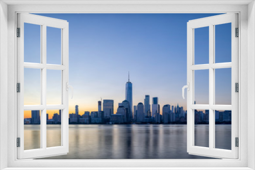 Fototapeta Naklejka Na Ścianę Okno 3D - Manhattan skyline at dawn, view from New Jersey