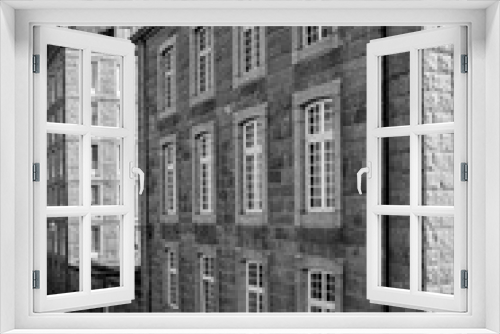 Fototapeta Naklejka Na Ścianę Okno 3D - black and white view of historic Norman stone houses in the Saint-Malo Intra-Muros Neighboorhood