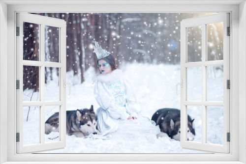 Fototapeta Naklejka Na Ścianę Okno 3D - Snow queen in winter. Fairy tale girl with Malamute.