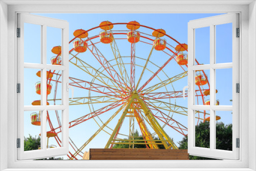Fototapeta Naklejka Na Ścianę Okno 3D - Ferris wheel against the summer blue sky