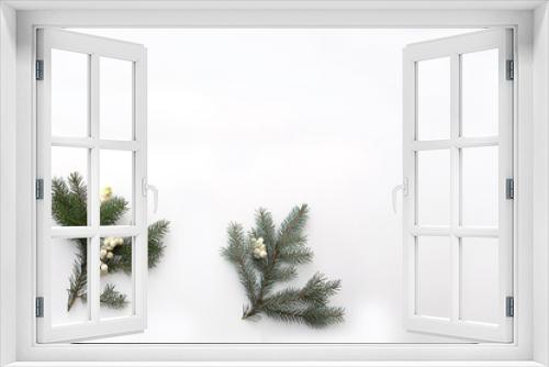 Fototapeta Naklejka Na Ścianę Okno 3D - Christmas composition. Pine branch with white berries on a light background.