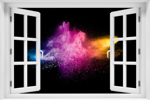 Fototapeta Naklejka Na Ścianę Okno 3D - Explosion of colorful Holi powder on black background. Vibrant color dust particles textured background.
