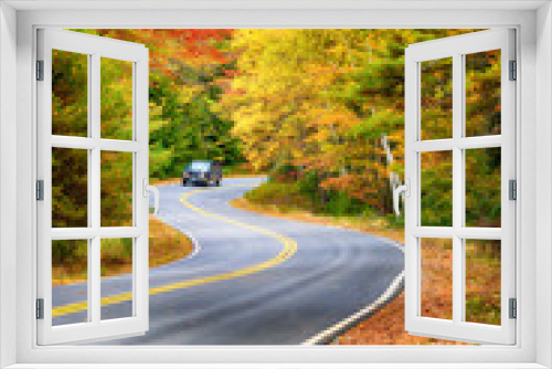 Fototapeta Naklejka Na Ścianę Okno 3D - Winding road through beautiful autumn foliage trees in New England