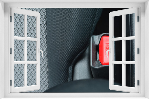 Fototapeta Naklejka Na Ścianę Okno 3D - the safety belt slot with the red button and letters 