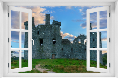 Fototapeta Naklejka Na Ścianę Okno 3D - Kilchurn Castle , in the care of Historic Environment Scotland , is a ruined structure on a rocky peninsula at Loch Awe in twilight , Argyll and Bute, Scotland